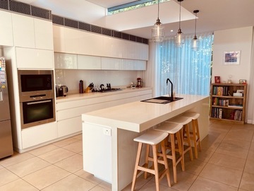 Renting out with online payment: Miele Appointed Kitchen with a Caesarstone Island Bench