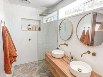 Renting out with online payment: Coastal Luxe Bathroom with Barn Door Feature