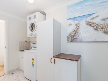 Renting out with online payment: Laundry Area with Washing Machine and Dryer