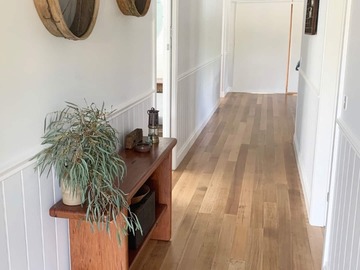 Renting out with online payment: Light-Filled White Walled Hallway