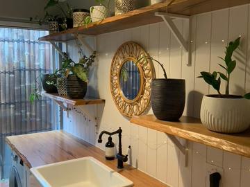 Renting out with online payment: Laundry with Timber Paneled Walls, Oak Benchtop and Shelving