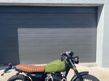 Renting out with online payment: Vintage-style army green motorbike